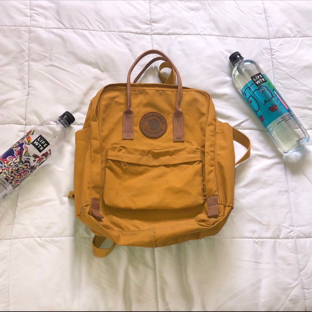 Yellow kanken backpack with leather detailing